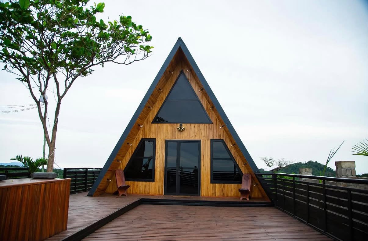 A-frame wooden cabin at Volta Peak with panoramic mountain views